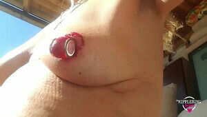 nippleringlover hot nude outdoors peeling huge red painted pierced nipples close up