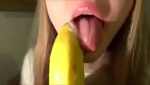 Ultra-cute Damsel Blowing a Banana with Condom